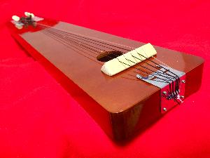 String order: Clear guitar G string and black ukulele strings 3, 2, 4, 1